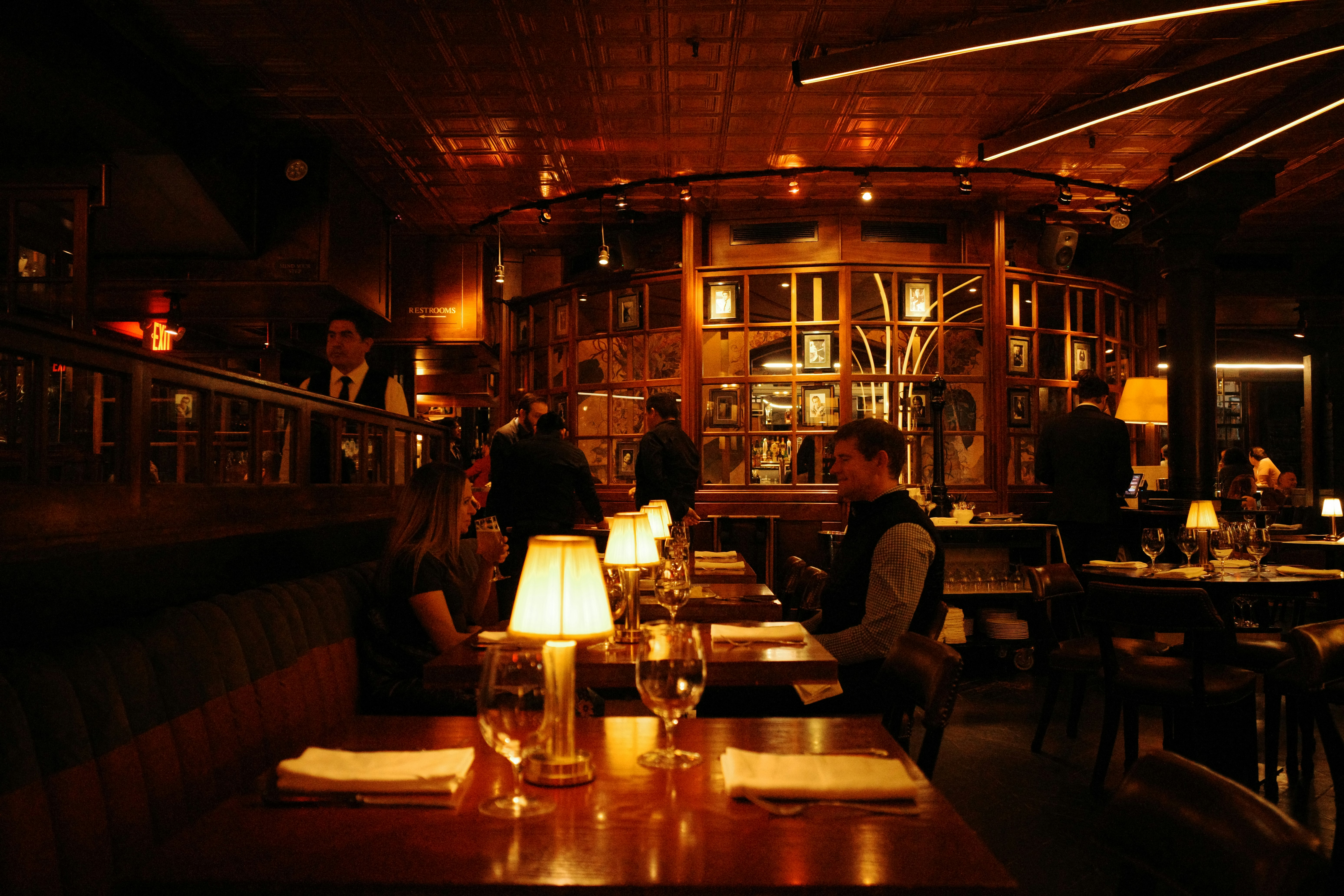 Guests enjoying meal with waiter, showing positive outcome